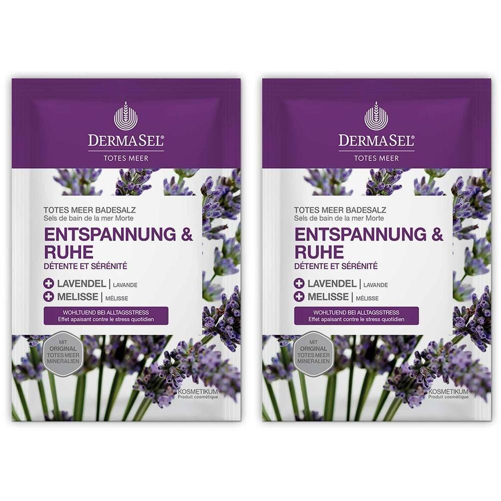 Zwei Beutel DERMASEL Totes Meer Badesalz. Lila-weiße Verpackung mit Produktnamen, Lavendel- und Melisse-Hinweisen. Text: Entspannung & Ruhe.