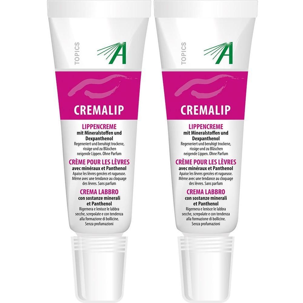Zwei Tuben CREMALIP Lippencreme. Weiße Tuben mit pinkfarbenem Streifen und Produktinformationen. Sichtbar sind Logos und Produktnamen.