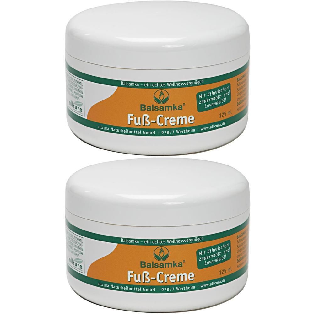 Zwei weiße Tiegel mit Deckel. Aufschrift: Balsamka Fuß-Creme. Grün-orangefarbener Aufkleber mit Text. 125 ml.