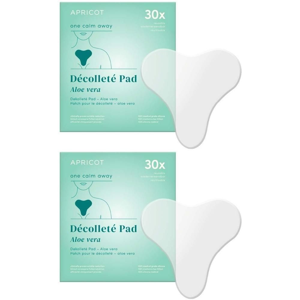 Zwei Packungen mit Pads. Aufschrift: APRICOT, Décolleté Pad Aloe vera. 30x. Zwei herzförmige Pads liegen daneben.