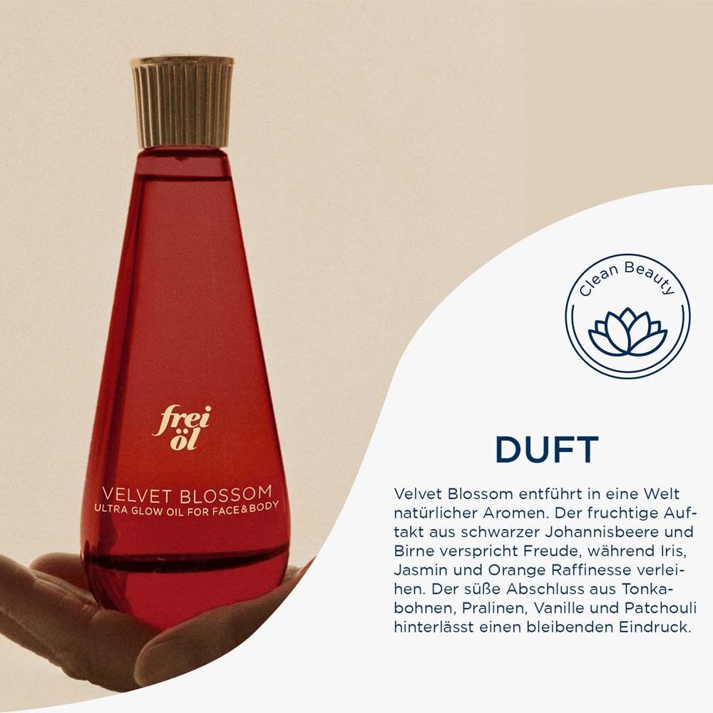 Hand hält eine Flasche frei öl® ULTRA GLOW ÖL Velvet Blossom. Text: Duft, Clean Beauty Siegel.