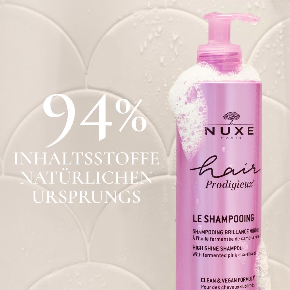 Rosa Shampoo-Flasche mit Text: 94% Inhaltsstoffe natürlichen Ursprungs. NUXE Hair Prodigieux, Le Shampooing.