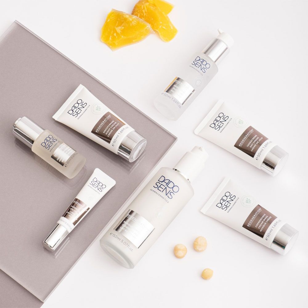 Mehrere DADO SENS REGENERATION Produkte, darunter Crememasken und Seren.
