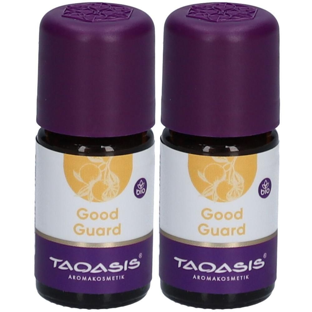 Zwei kleine Glasflaschen mit lila Deckeln. Auf den Etiketten steht "Good Guard" und "TAOASIS Aromakosmetik". Bio-Siegel.