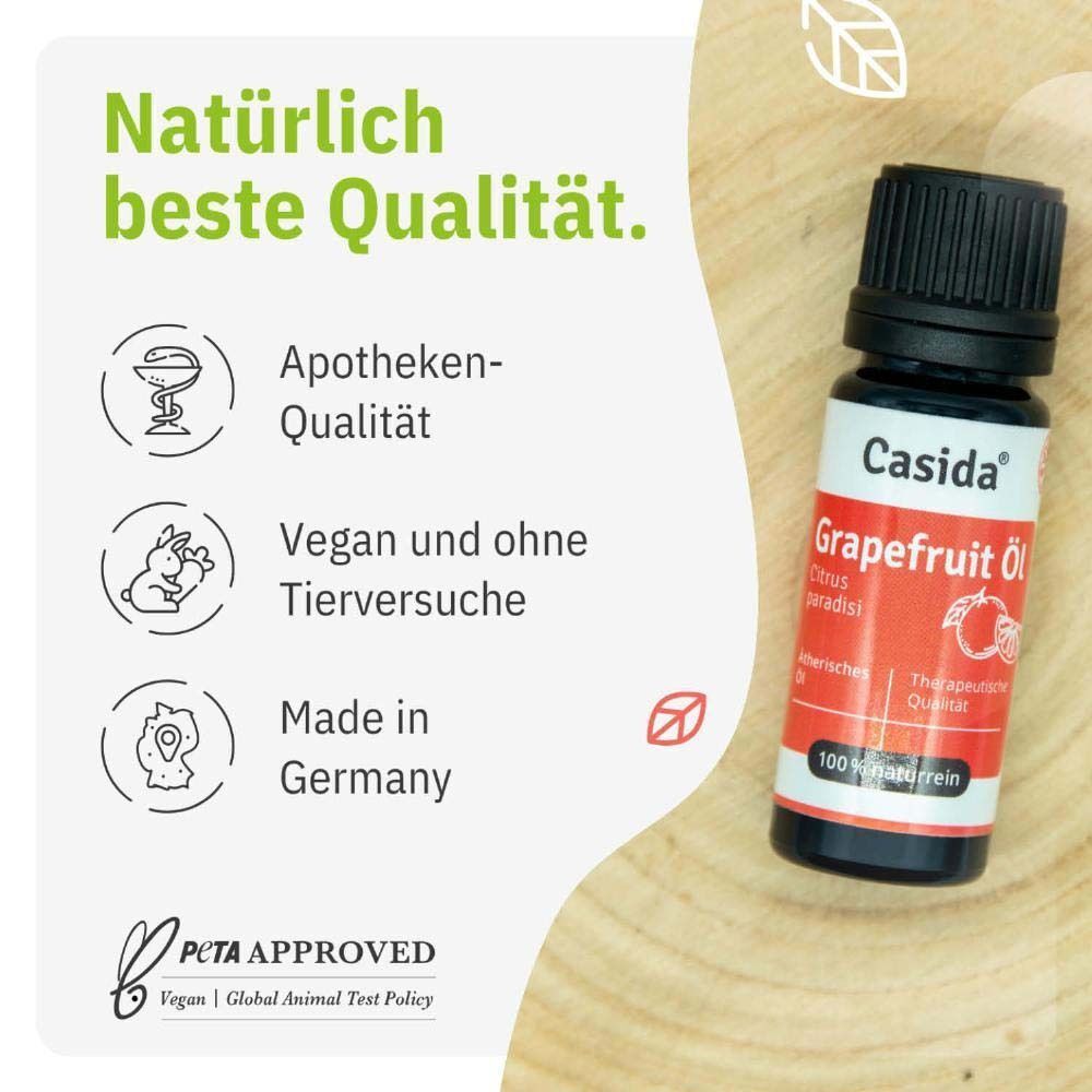 Flasche Casida® Grapefruit Öl. Schwarze Kappe, weißes Etikett mit rotem Band. Text: Grapefruit Öl, Citrus paradisi, therapeutische Qualität. Icons: Apotheken-Qualität, vegan.