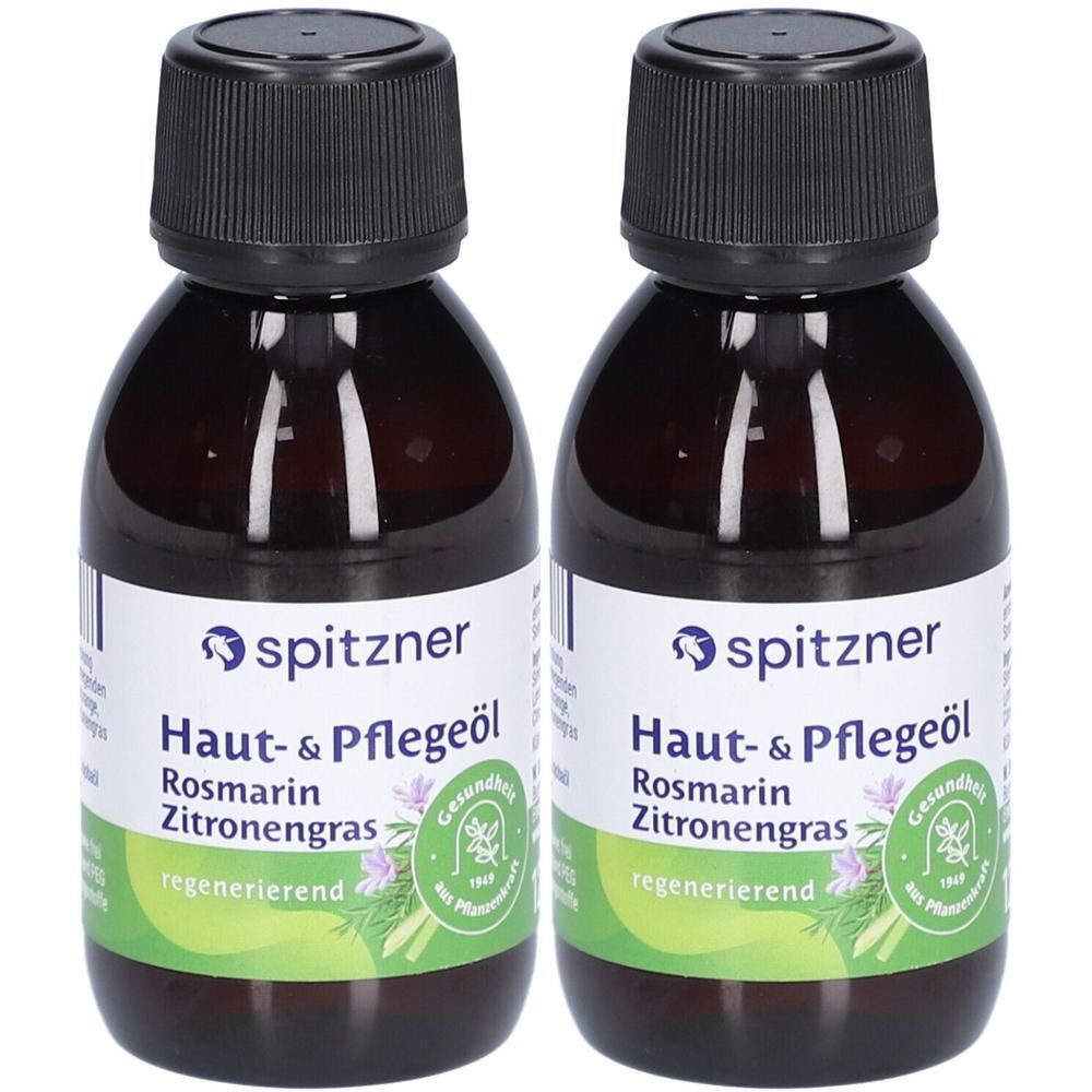 Zwei braune Flaschen mit schwarzem Verschluss. Auf den Etiketten steht "spitzner Haut- & Pflegeöl Rosmarin Zitronengras".