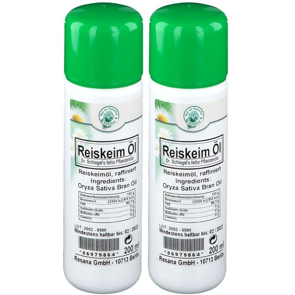 Zwei weiße Flaschen mit grünem Deckel. Aufschrift: Reiskeim Öl, Inhaltsstoffe: Oryza Sativa Bran Oil. 200 ml. Marke: Resana.