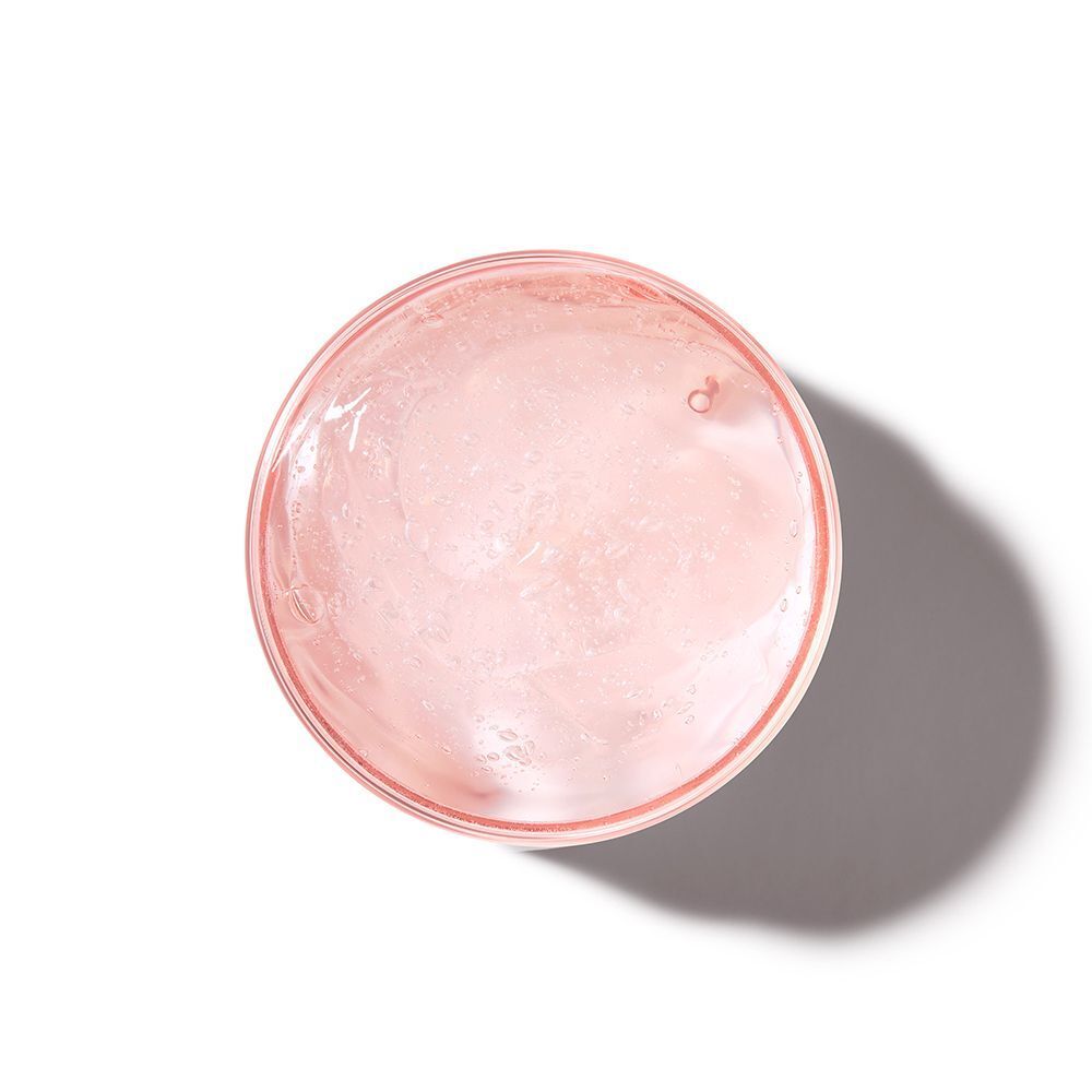 Draufsicht auf rosa Gel in einem Glasbehälter. Hintergrund weiß.