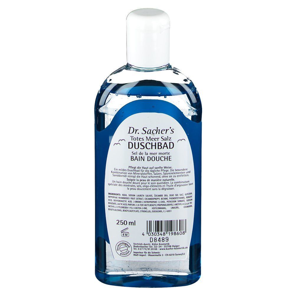 Rückseite einer Duschbadflasche. Blaue Flüssigkeit. Etikett mit Produktinformationen, Inhaltsstoffen und Herstellerangaben. Mit weißem Deckel.