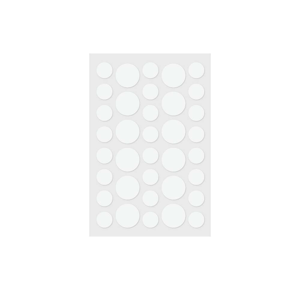 Blatt mit runden, weißen UV-Indikator-Stickern. Unterschiedliche Größen. Auf transparentem Träger.