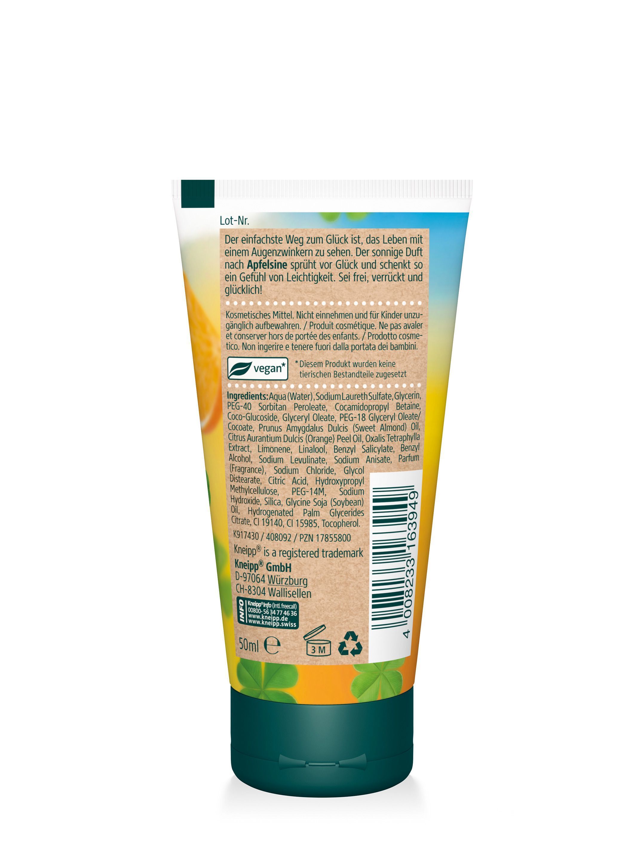 Rückseite einer Tube Aroma-Pflegedusche. Grün-weiße Tube mit Text und Inhaltsangaben. Vegan-Logo. Kleeblatt-Motiv. Orange-Abbildung.