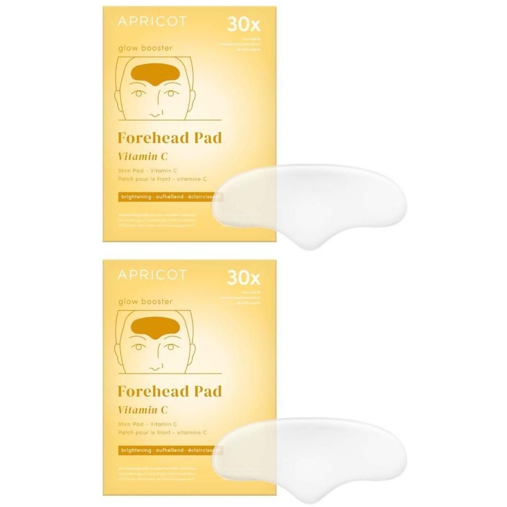 Zwei Packungen mit Stirn Pads. Aufschrift: APRICOT, glow booster, Forehead Pad, Vitamin C. Daneben zwei Pads.