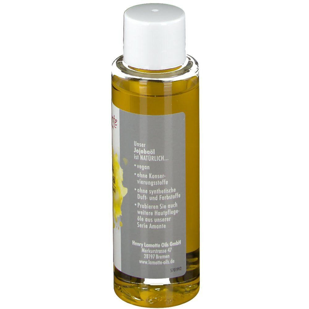 Rückseite einer Jojobaöl-Flasche. Graues Etikett mit Text. "Unser Jojobaöl ist NATÜRLICH".