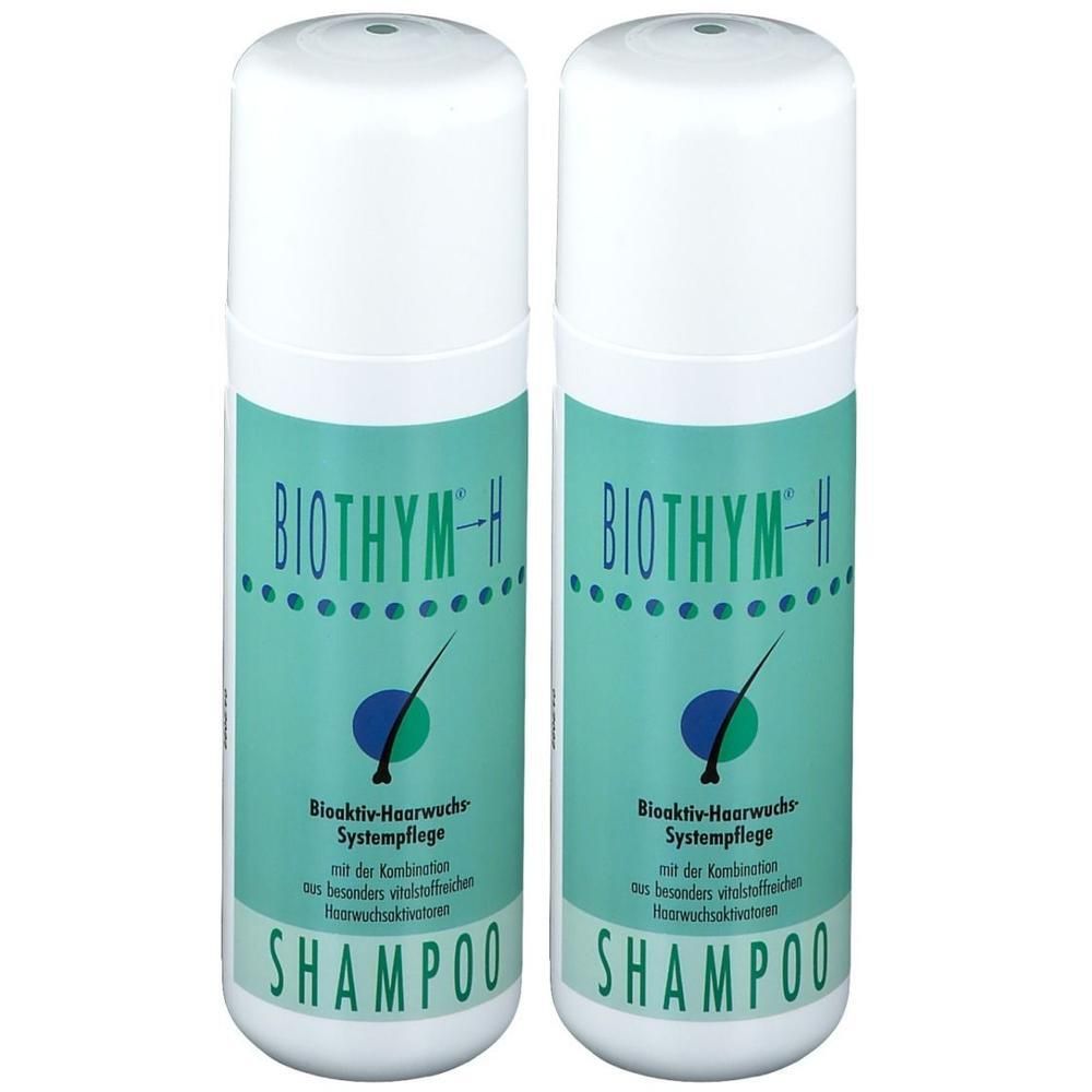Zwei weiße Flaschen BIOTHYM-H Haarshampoo. Türkisgrüne Etiketten mit Produktinformationen und dem Wort SHAMPOO.