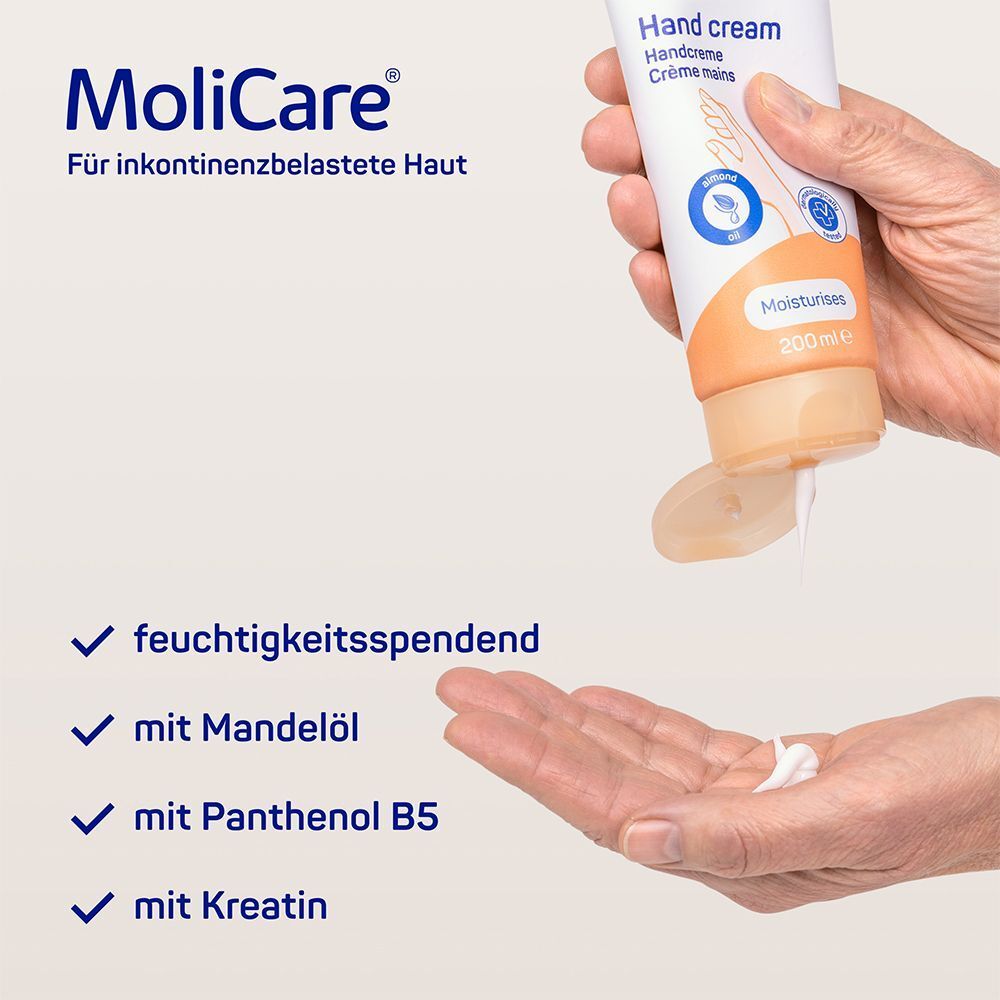 Handcreme wird aus Tube in Hand gedrückt. Text: feuchtigkeitsspendend, mit Mandelöl, mit Panthenol B5, mit Kreatin. Produkt: MoliCare Skin Handcreme.