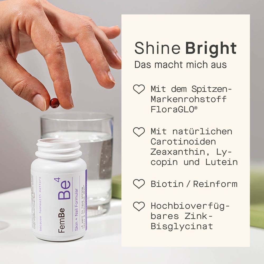 Eine Hand hält eine Kapsel über einer Flasche FemBe4. Text: Mit Carotinoiden, Biotin, Zink.