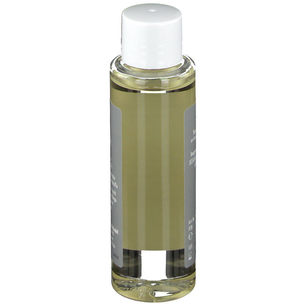 Hautpflegeöl-Flasche. Rückseite mit Text. Transparente Flasche mit weißem Verschluss. Etikett mit Produktinformationen.