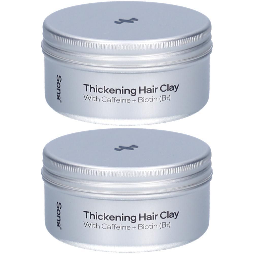 Zwei silberfarbene Tiegel mit Deckel. Auf der Vorderseite steht "Thickening Hair Clay" und "Sons".
