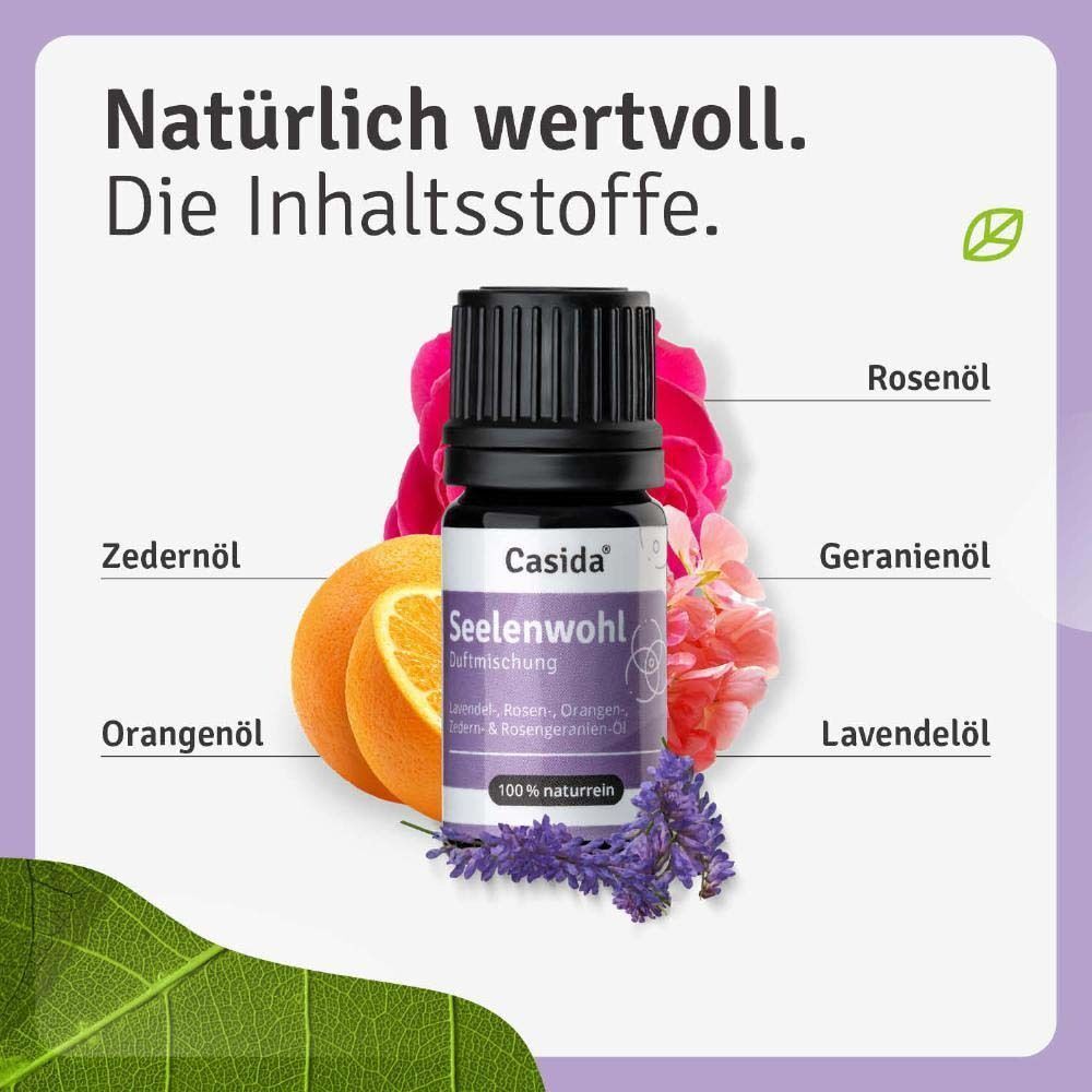Flasche Casida® Seelenwohl. Violettes Etikett, schwarzer Deckel. Inhaltsstoffe: Rosenöl, Geranienöl, Lavendelöl, Orangenöl, Zedernöl.