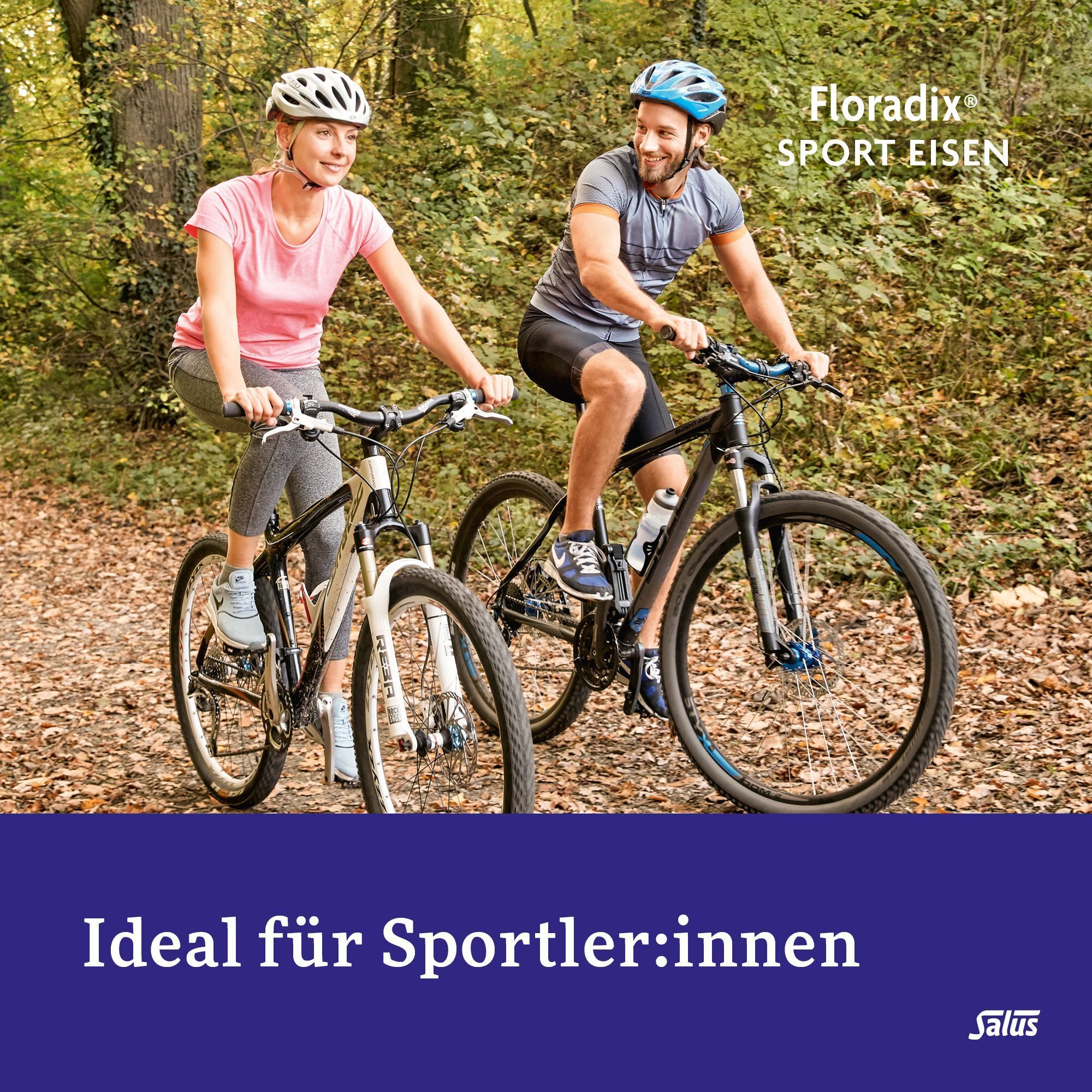Ein Paar fährt Fahrrad in einem Wald. Floradix Sport Eisen ist ideal für Sportler.