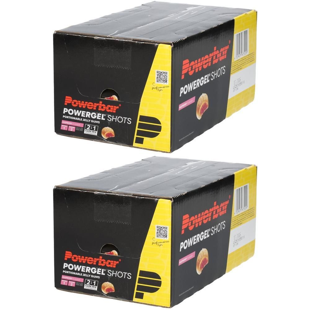 Zwei Schachteln Powerbar Powergel Shots mit Himbeergeschmack. Schwarze Schachteln mit gelben Akzenten und dem Powerbar-Logo.