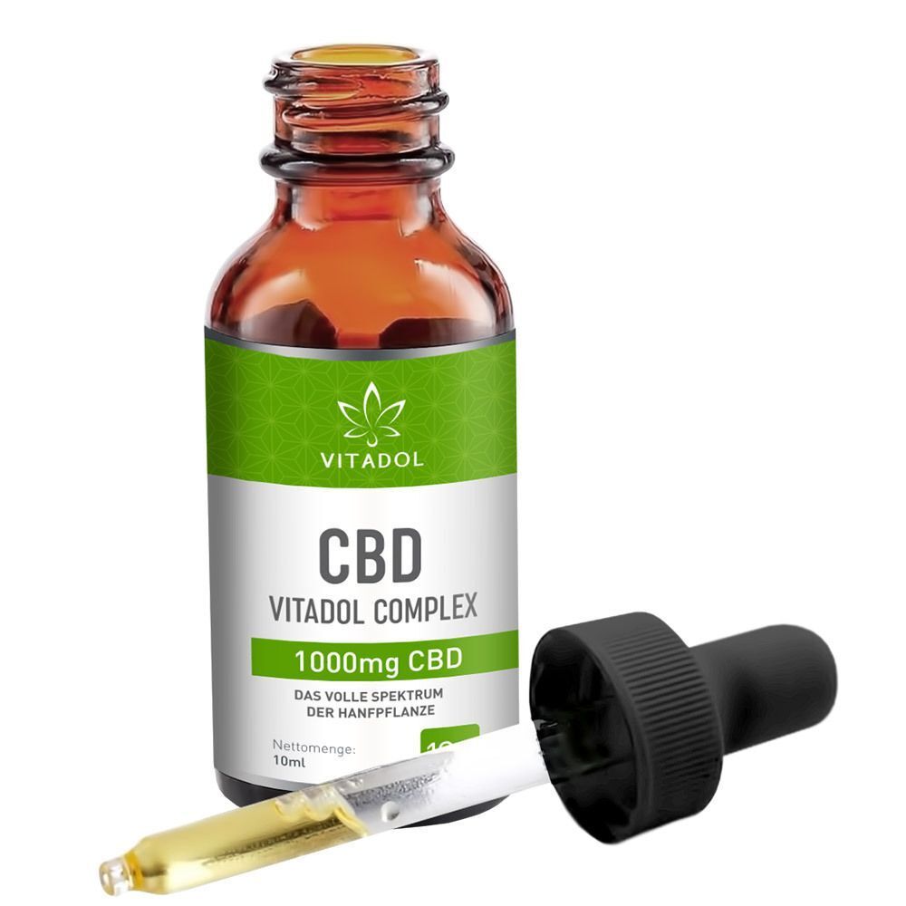 Vitadol Complex 10% CBD Flasche mit Pipette. Braune Glasflasche mit grünem Etikett. Pipette liegt daneben.