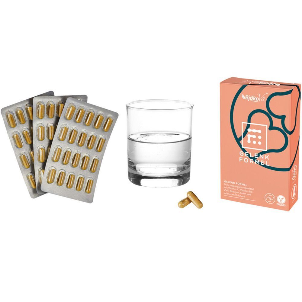 Drei Blisterpackungen mit Tabletten, ein Glas Wasser und eine Schachtel mit der Aufschrift "Gelenk Formel".