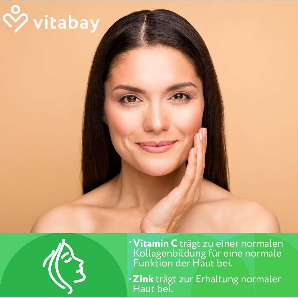 Porträt einer Frau. Text: Vitamin C trägt zur normalen Kollagenbildung für die Haut bei. Zink für Erhaltung normaler Haut.