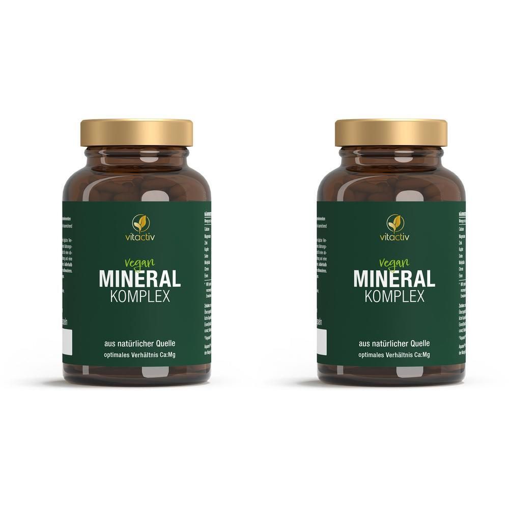 Zwei braune Glasflaschen mit goldfarbenen Deckeln. Auf jeder Flasche steht "Vegan MINERAL KOMPLEX" und "vitactiv".