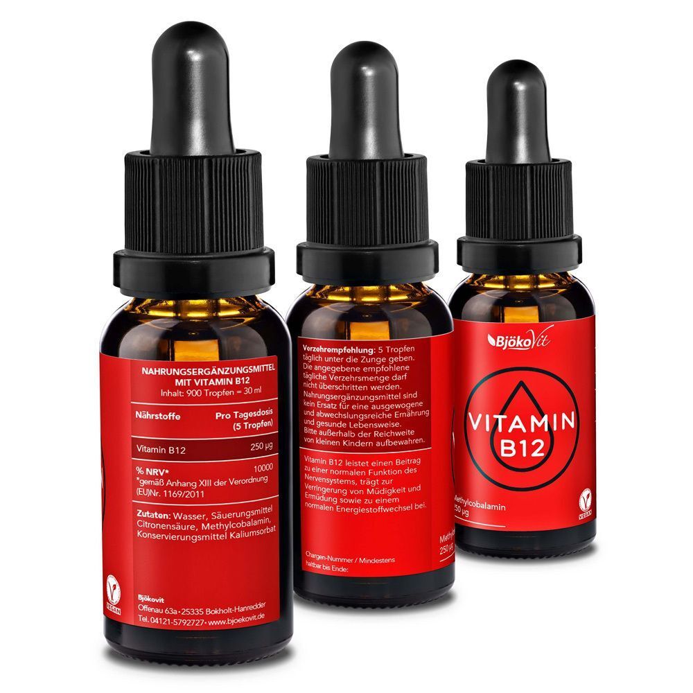 Drei Flaschen BjökoVit Vitamin B12 Tropfen, eine von hinten mit Nährwertangaben.