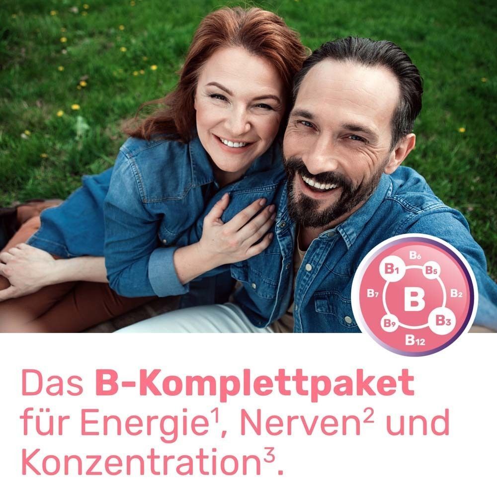 Ein Paar lächelt im Freien. Im Hintergrund ein B-Komplettpaket-Symbol. Text: Das B-Komplettpaket für Energie, Nerven und Konzentration.