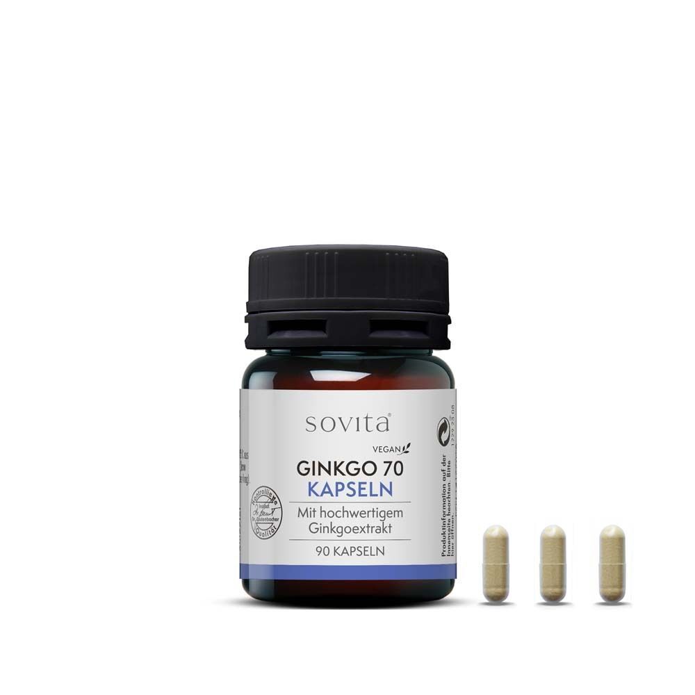 Eine Flasche sovita® Ginkgo 70 Kapseln und drei Kapseln daneben. Braune Glasflasche mit schwarzem Deckel. Vegan.