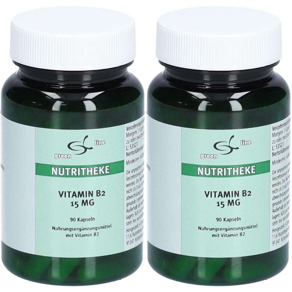 Zwei grüne Flaschen mit weißen Deckeln. Aufschrift: NUTRITHEKE, VITAMIN B2 15 MG, 90 Kapseln. Nahrungsergänzungsmittel.