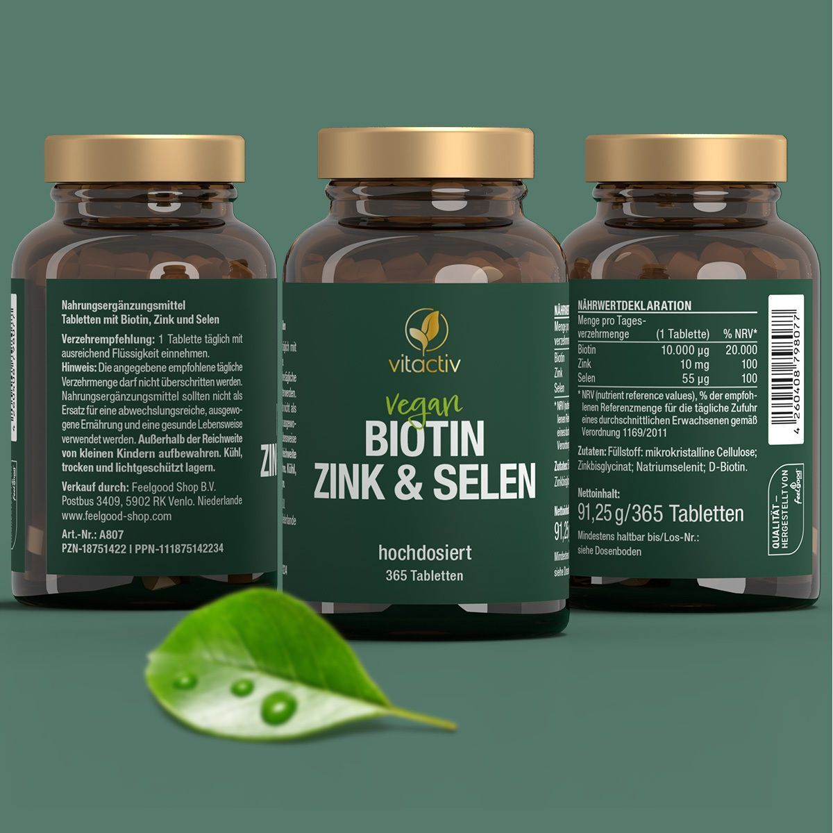 Drei Flaschen "Vegan Biotin Zink & Selen" mit Etiketten. Blatt.
