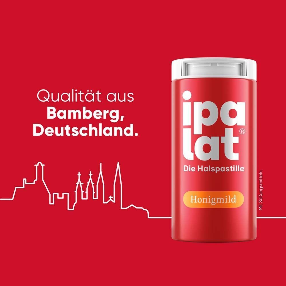Rote Dose IPALAT Halspastillen honigmild. Weißer Deckel. Text: Qualität aus Bamberg, Deutschland. Stadtansicht.