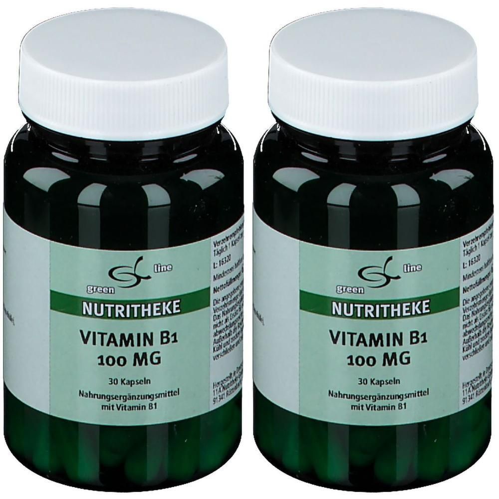 Zwei grüne Flaschen mit weißen Deckeln. Auf den Etiketten steht "NUTRITHEKE VITAMIN B1 100 MG". Enthält 30 Kapseln. Nahrungsergänzungsmittel.