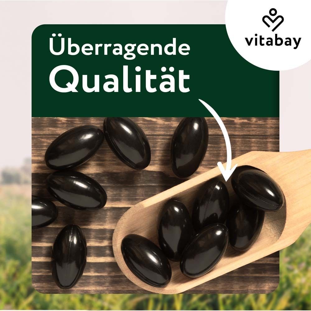 Holzlöffel mit schwarzen Softgels. Marke: vitabay. Text: Überragende Qualität.