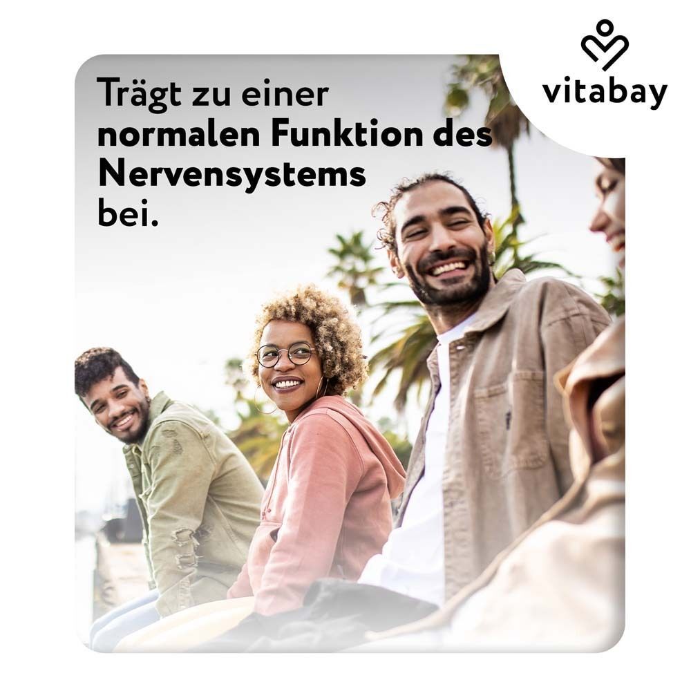 Menschen lachen. Text: Trägt zu einer normalen Funktion des Nervensystems bei.