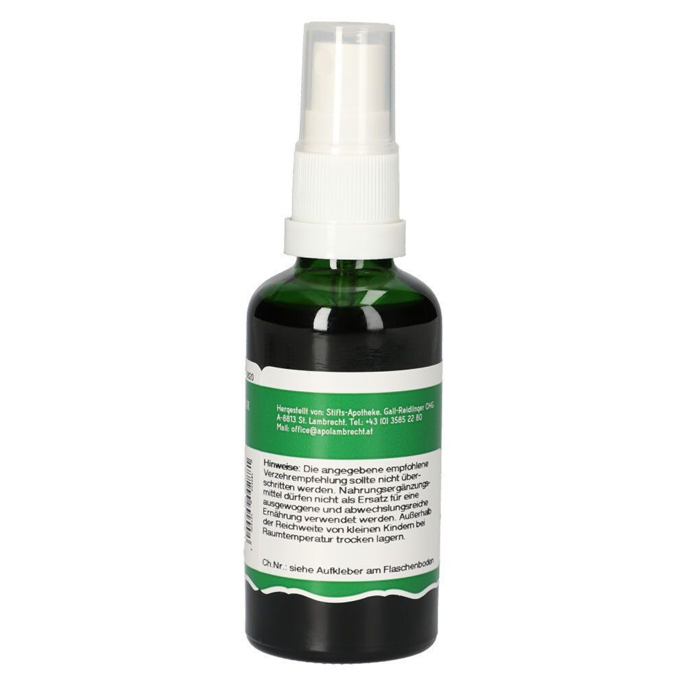 Grüne Glasflasche mit Sprühkopf. Etikett mit Text und Informationen. Aufkleber am Flaschenboden.