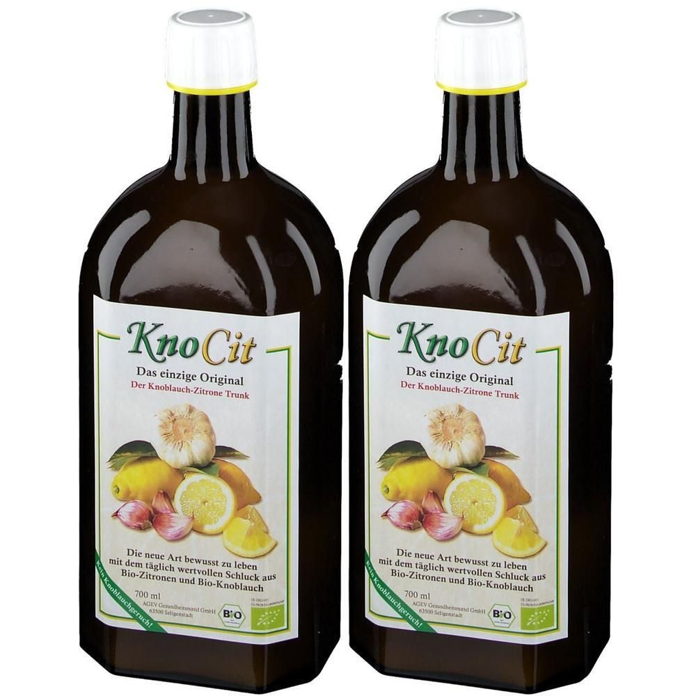 Zwei braune Glasflaschen mit weißem Verschluss, gefüllt mit KnoCit Knoblauch-Zitronen-Trunk. Etikett zeigt Knoblauch, Zitronen und Bio-Siegel.