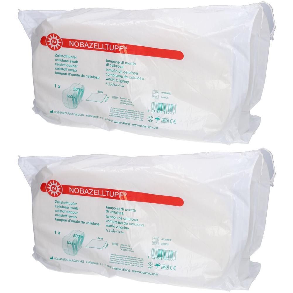 Zwei verpackte NOBAZELLTUPF® Zellstofftupfer. Weiße, rechteckige Tupfer in transparenter Folie. Aufdruck mit Produktinformationen.