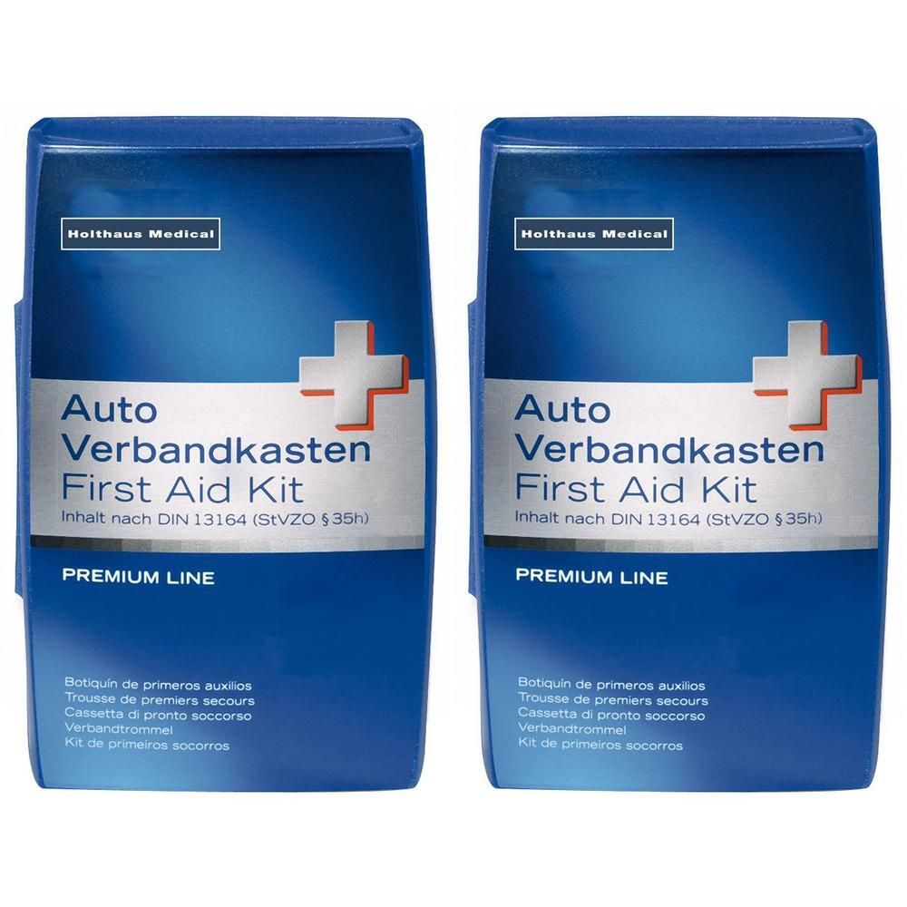 Zwei blaue Verbandkästen mit weißem Kreuz. Aufschrift: Auto Verbandkasten, First Aid Kit, Premium Line. Marke: Holthaus Medical.