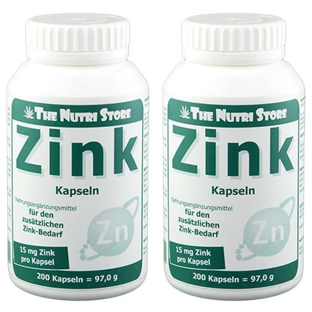 Zwei weiße Flaschen mit Schraubverschluss. Aufschrift: Zink Kapseln, 15 mg Zink pro Kapsel, 200 Kapseln. Marke: The Nutri Store.