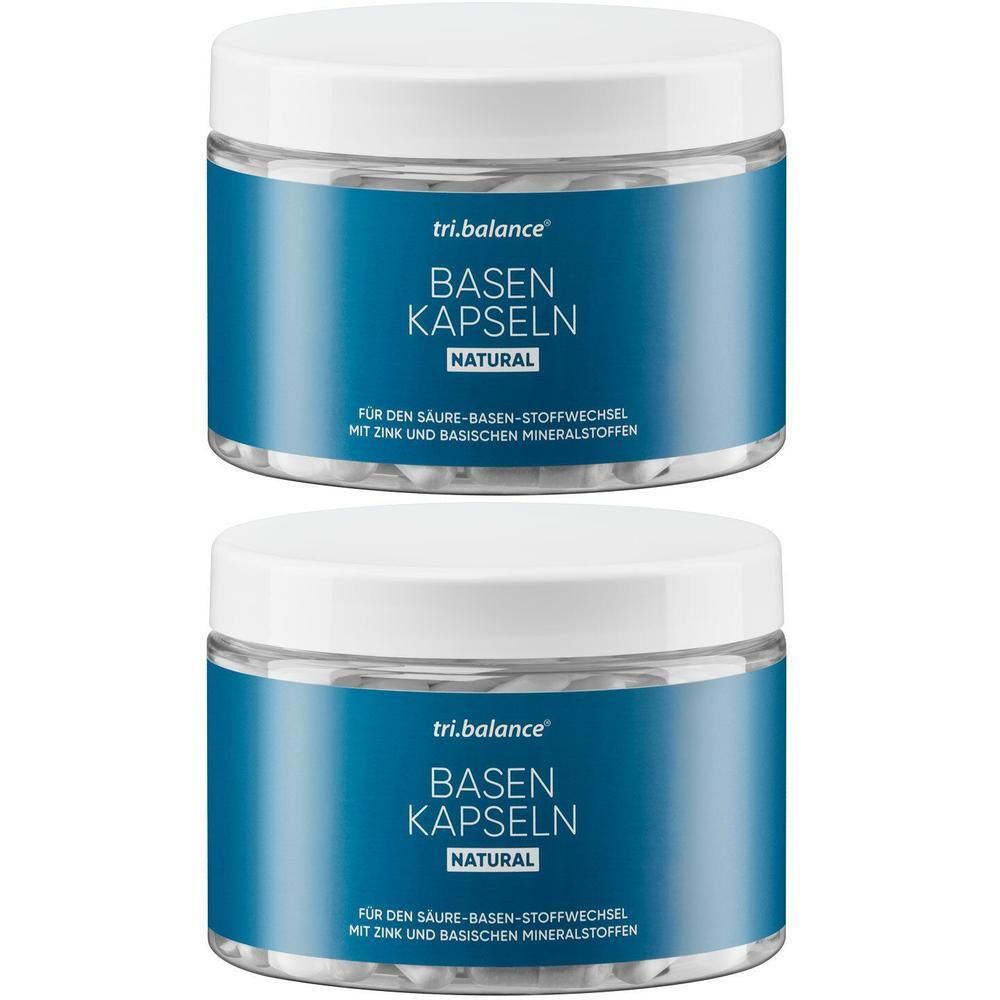 Zwei Dosen TRI.BALANCE Basenkapseln NATURAL. Blaue Etiketten mit weißer Schrift. Deckel weiß.