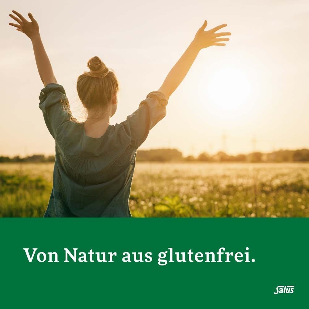 Frau im Feld, Arme oben. Text: Von Natur aus glutenfrei. Salus Logo.