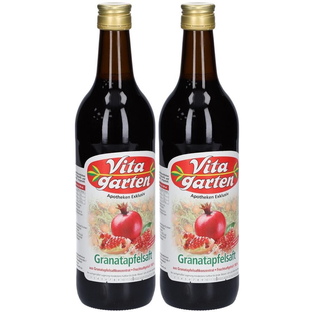 Zwei Flaschen Vita Garten Granatapfelsaft mit Granatapfelabbildung auf dem Etikett.