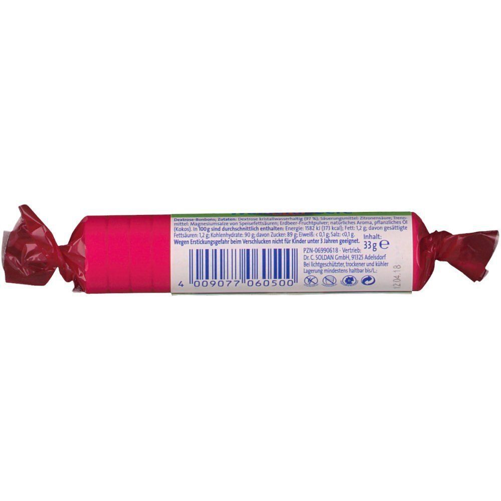 Zylinderförmige Süßigkeit in pinkfarbener Folie. Aufschrift und Barcode. Rote Enden. Rückseite mit Informationen.