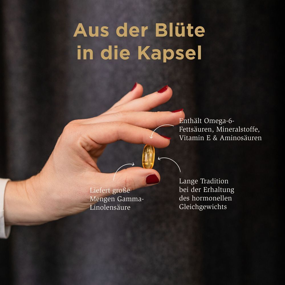 Hand hält eine Kapsel. Text: "Enthält Omega-6-Fettsäuren, Mineralstoffe, Vitamin E & Aminosäuren".