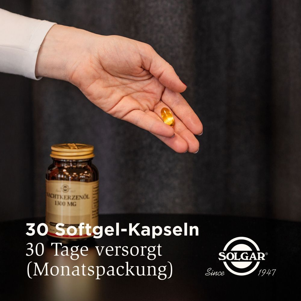 Hand hält eine Kapsel über einer Flasche. Text: "30 Softgel-Kapseln". "Monatspackung". Logo: SOLGAR.