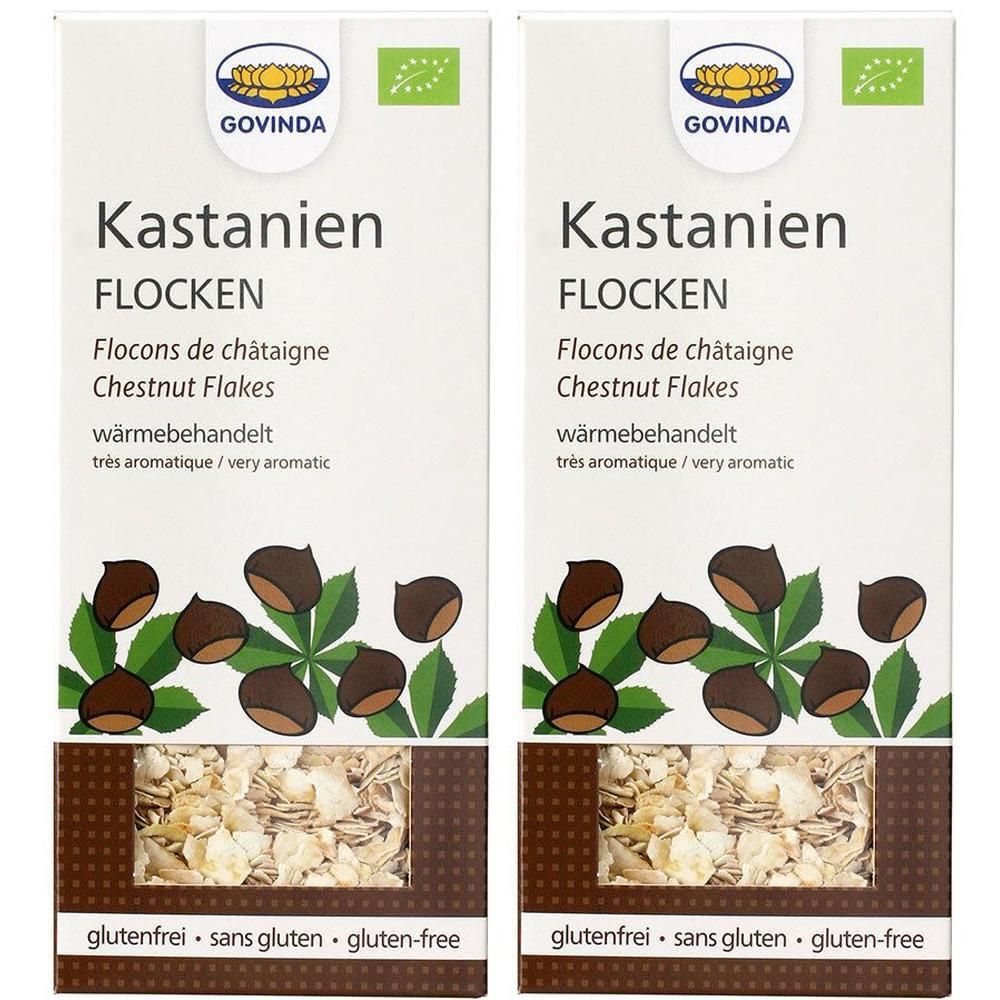 Zwei Packungen Kastanienflocken. Aufschrift: GOVINDA, Kastanien Flocken, glutenfrei. Abbildung von Kastanien und Blättern.